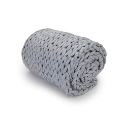 Rolled blanket on white background