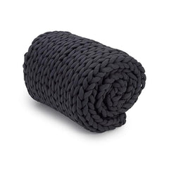 Charcoal blanket rolled on white background